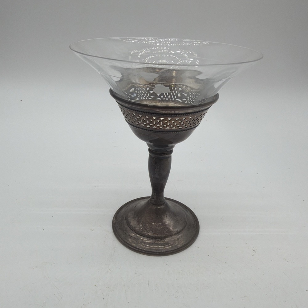 vintage pedestal compote features a clear flared glass bowl
